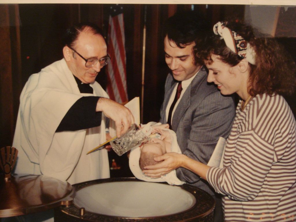 A child being baptized in a Catholic church