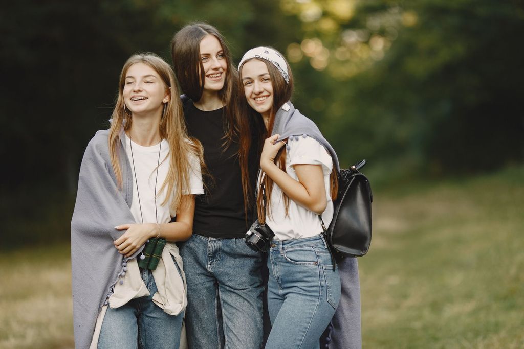 Teen friends smiling outdoors