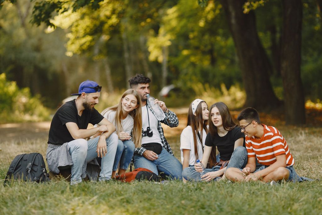 Teenagers laughing together in the park